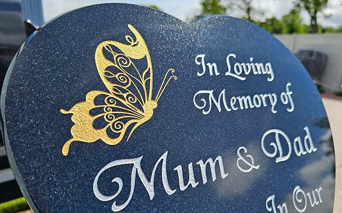 Heart shaped granite plaque with butterfly in gold and inscriptions in silver