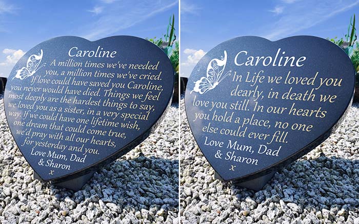 2 heart shaped granite plaques with inscriptions and a butterfly